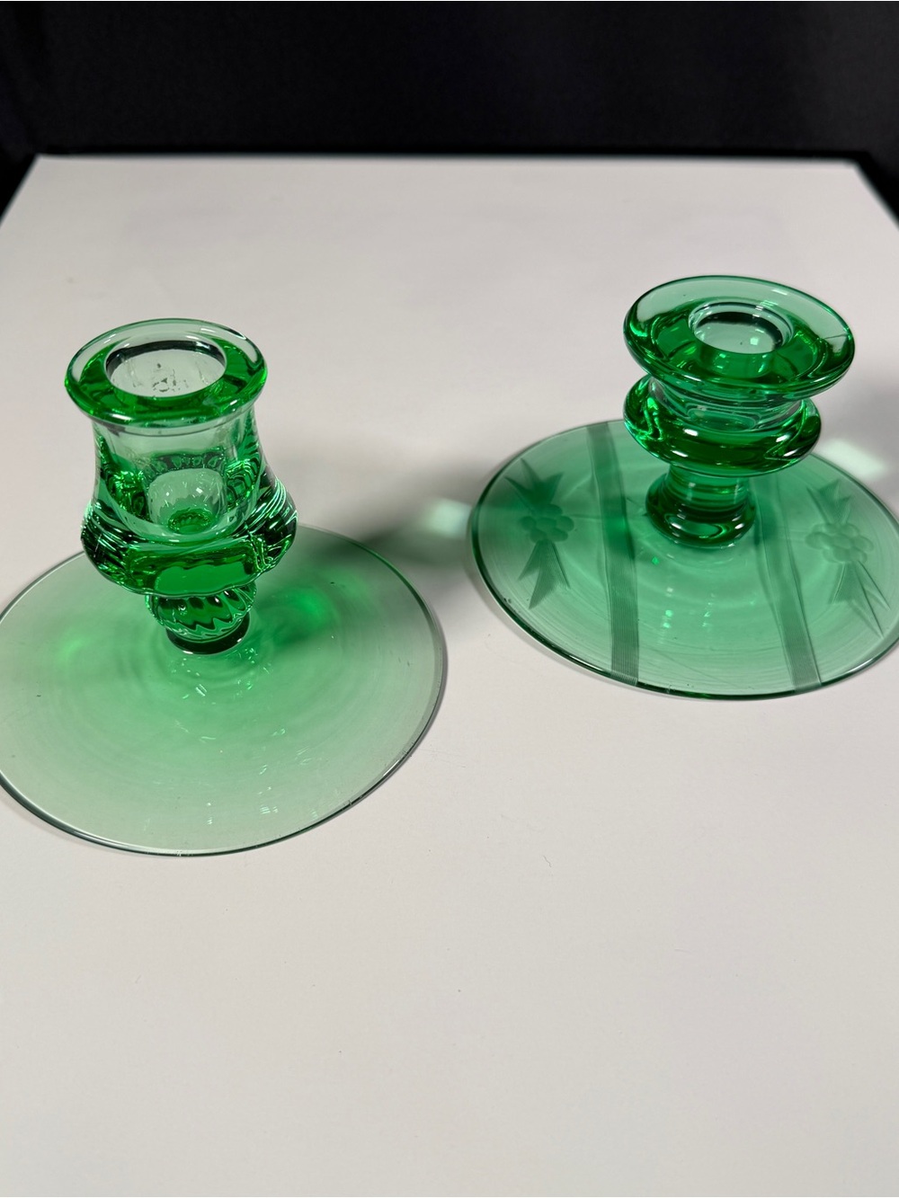 Mismatched Fostoria pair of Green Glass Candle Holders, one etched glows,